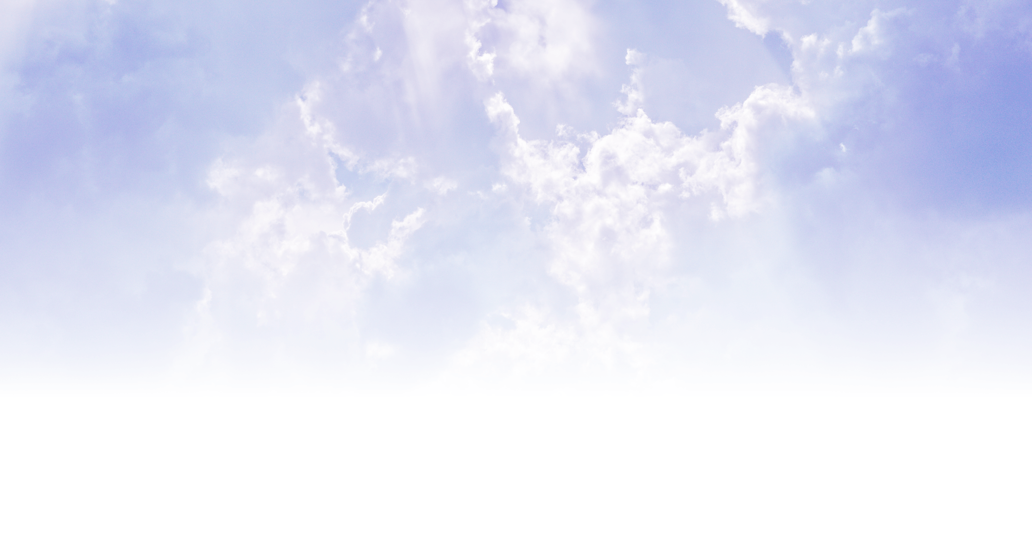 A cloudy sky with soft sunlight filtering through, creating a serene and peaceful atmosphere with gentle hues of blue and white.
